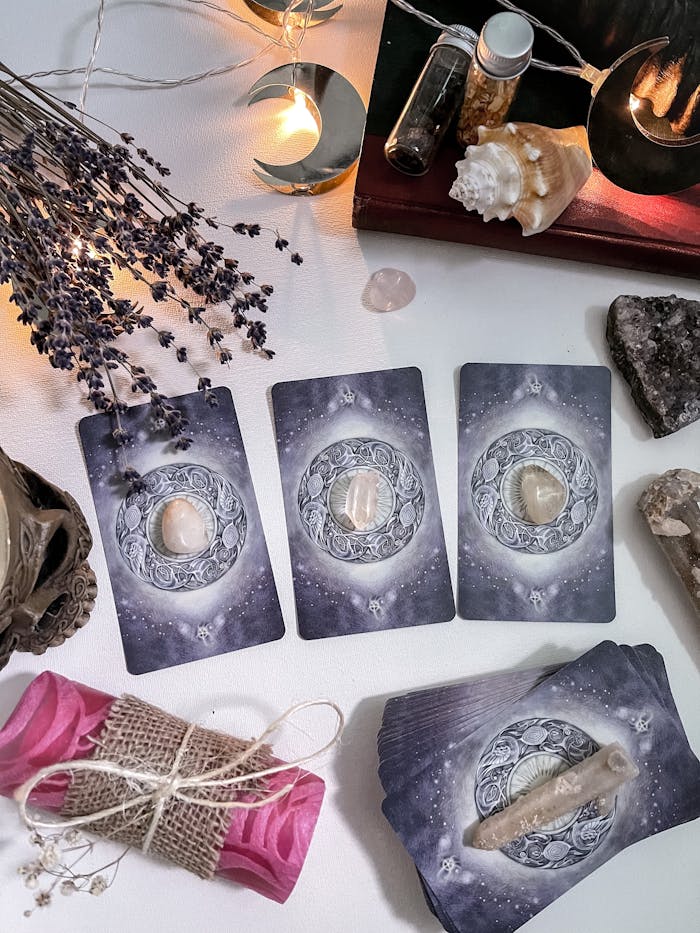 An enchanting setup with tarot cards, crystals, and flowers for a mystical ambiance.